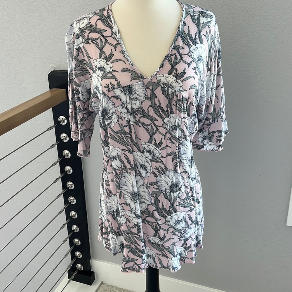 Flowy blouse with ruffled hem and sleeves